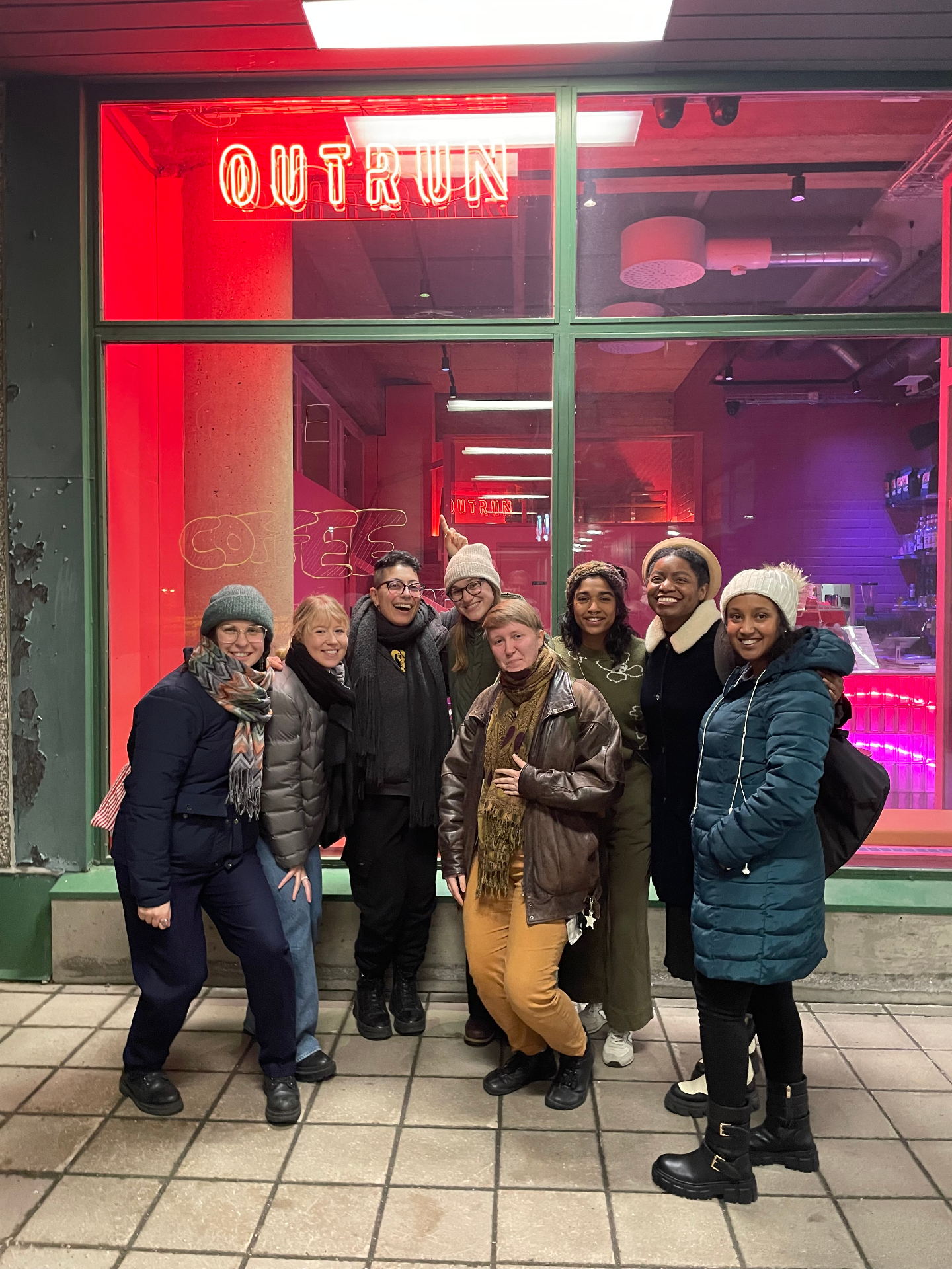 Participants from one of the early structured social experiments, gathered outside a Helsinki cafe at night